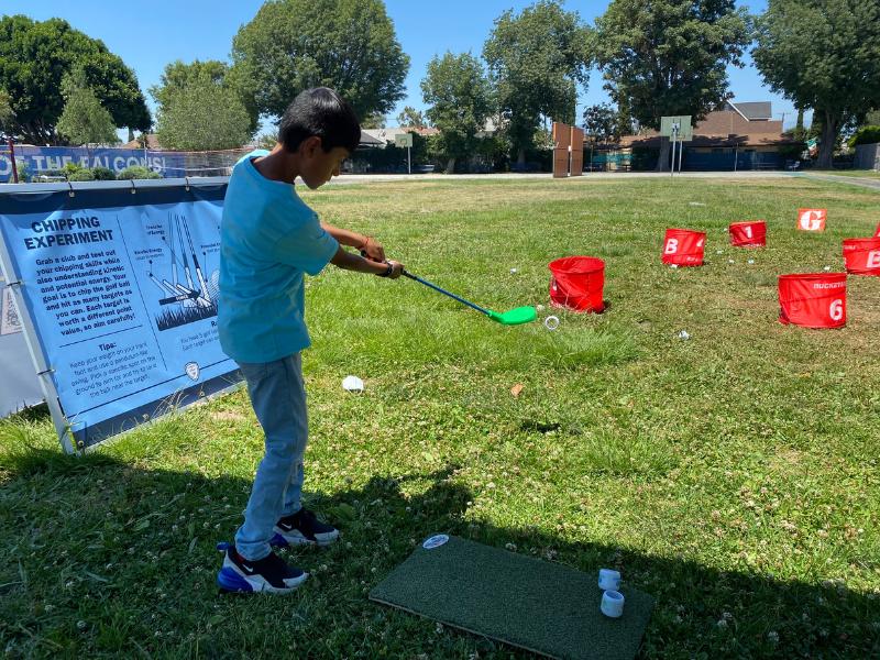 Kid playing golf